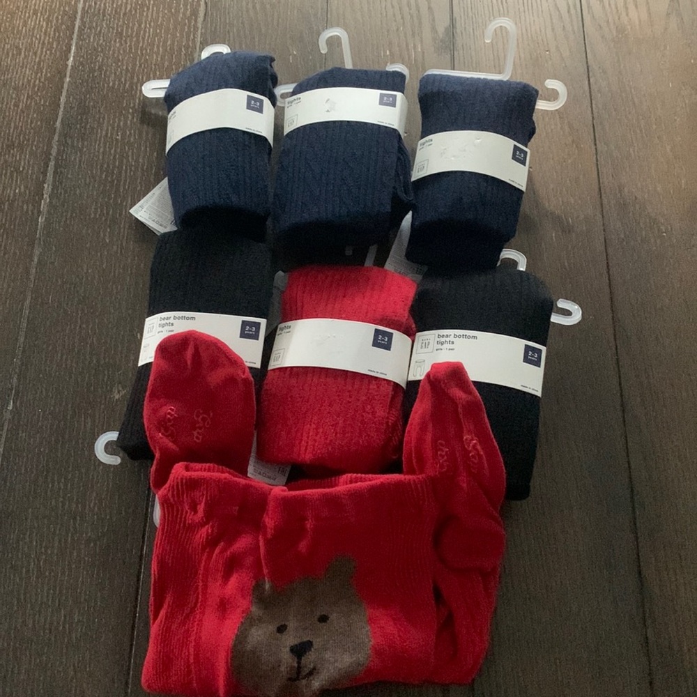 Baby Gap girls tights (7) pairs, 3 blue, 2 black, 2 red Sz 2-3 years. NWT